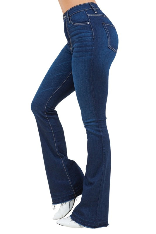 Dark wash bootcut jeans, side view, contrast topstitching and frayed hem