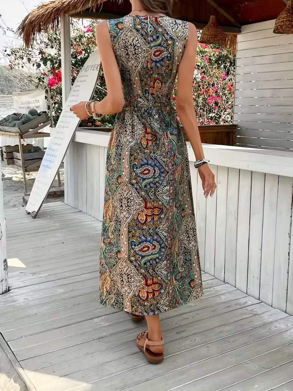 Back view: multicolor paisley sleeveless long-top romper with skirt slit