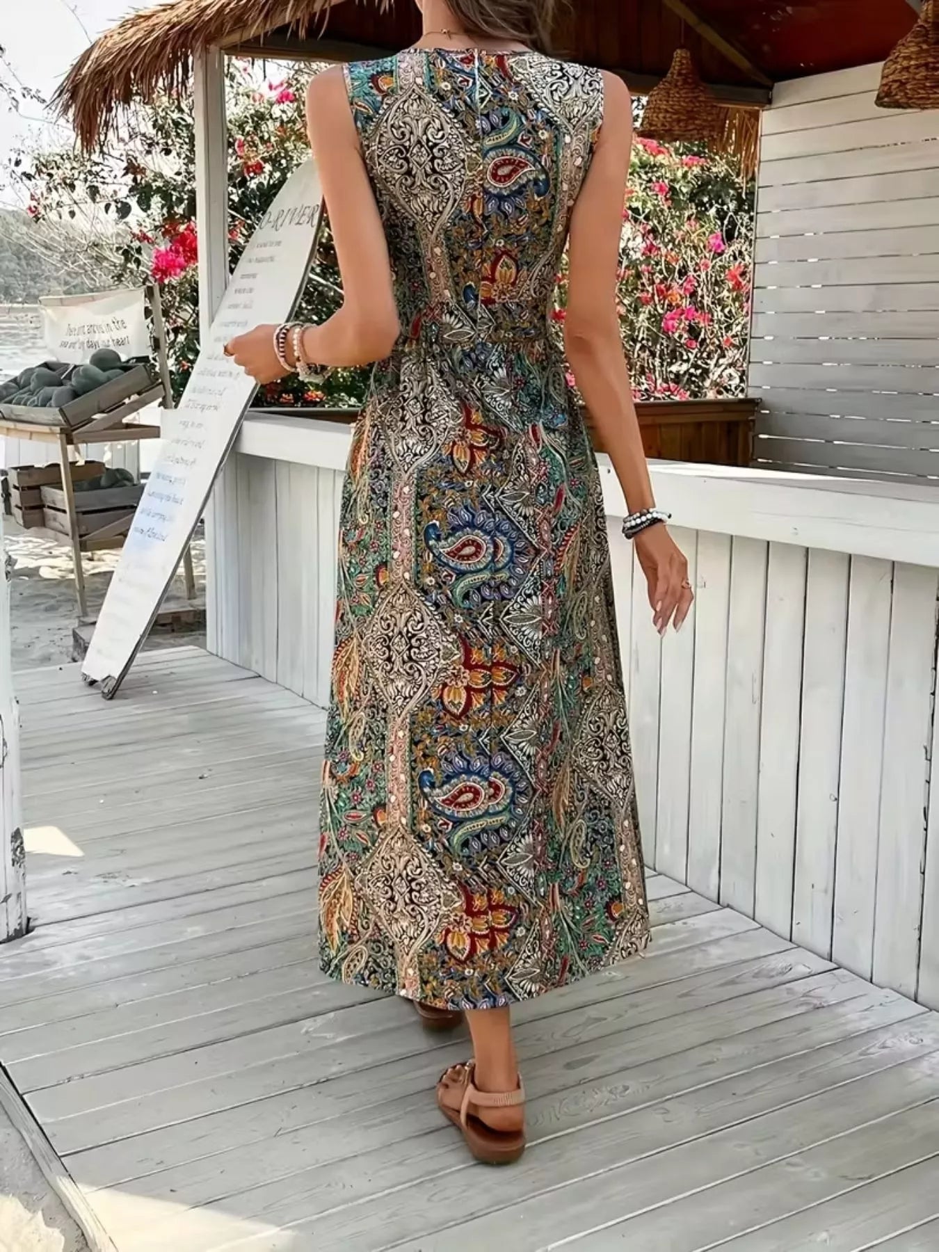 Back view: multicolor paisley sleeveless long-top romper with skirt slit