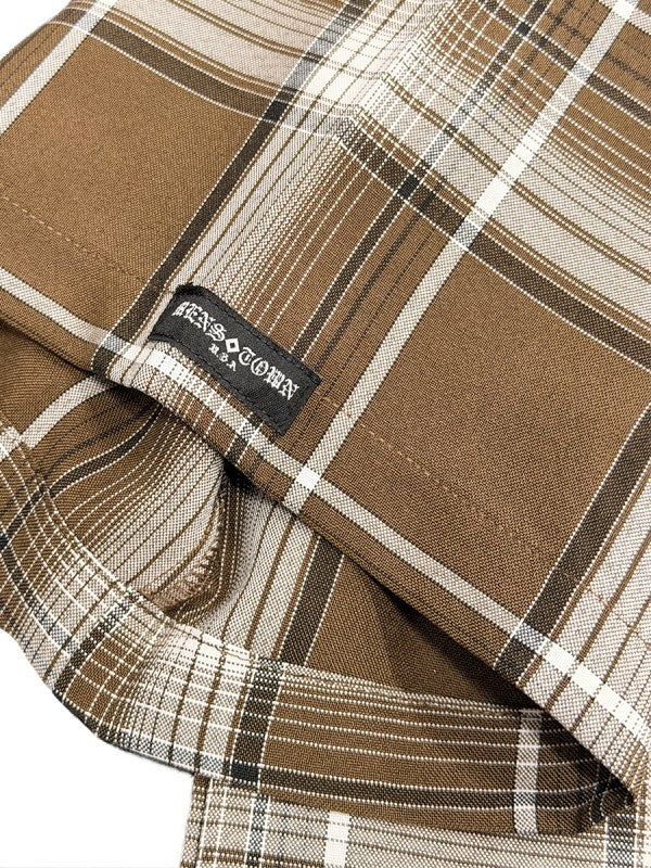 Men's plaid button-down shirt label near hem, tan-brown with white and dark stripes