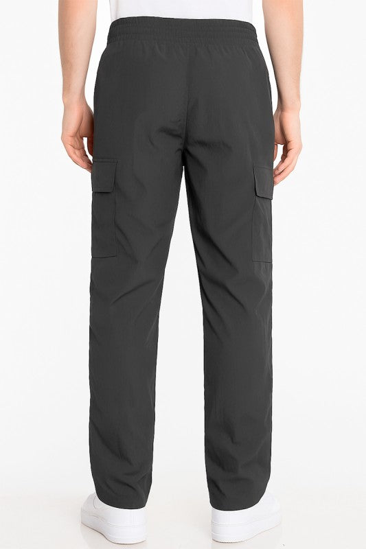 Men's black nylon cargo pants with elastic waist and rear cargo pocket