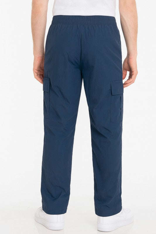 Navy cargo pants, relaxed straight leg, elastic waistband, side cargo flap pockets