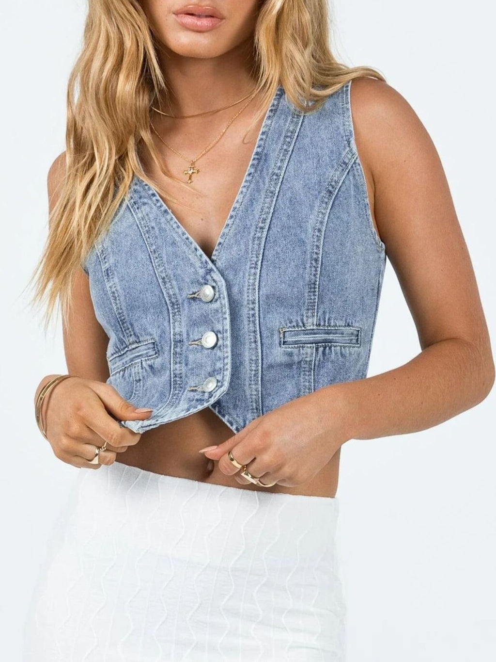 V-neck light-wash denim button-up vest with metal buttons and chest pockets