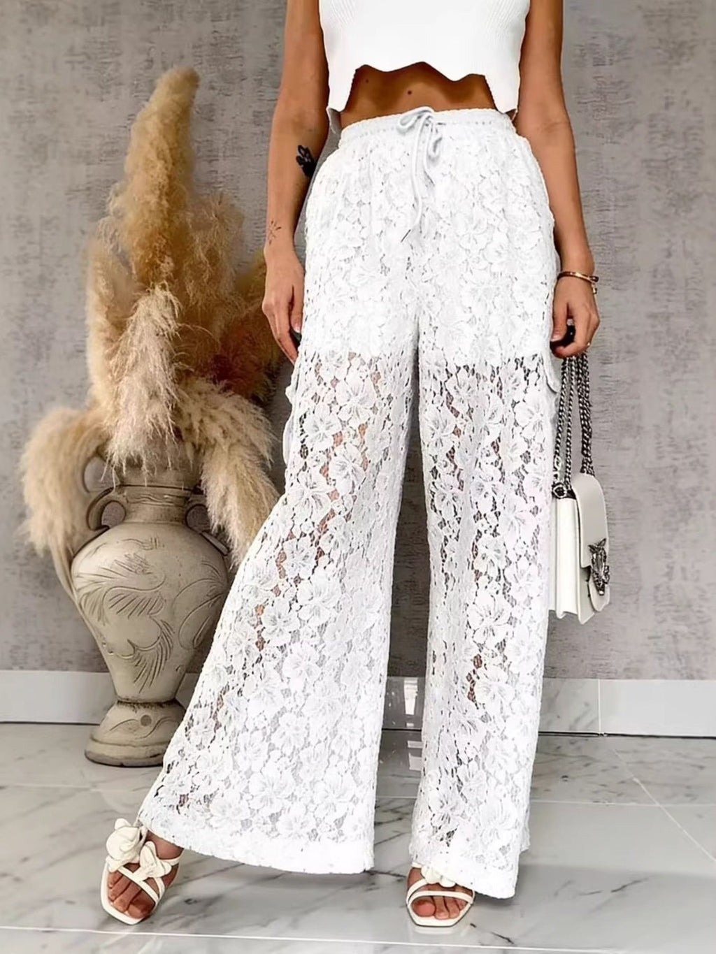 Women’s lace wide-leg pants, white—side view with scalloped lace texture and tie waist
