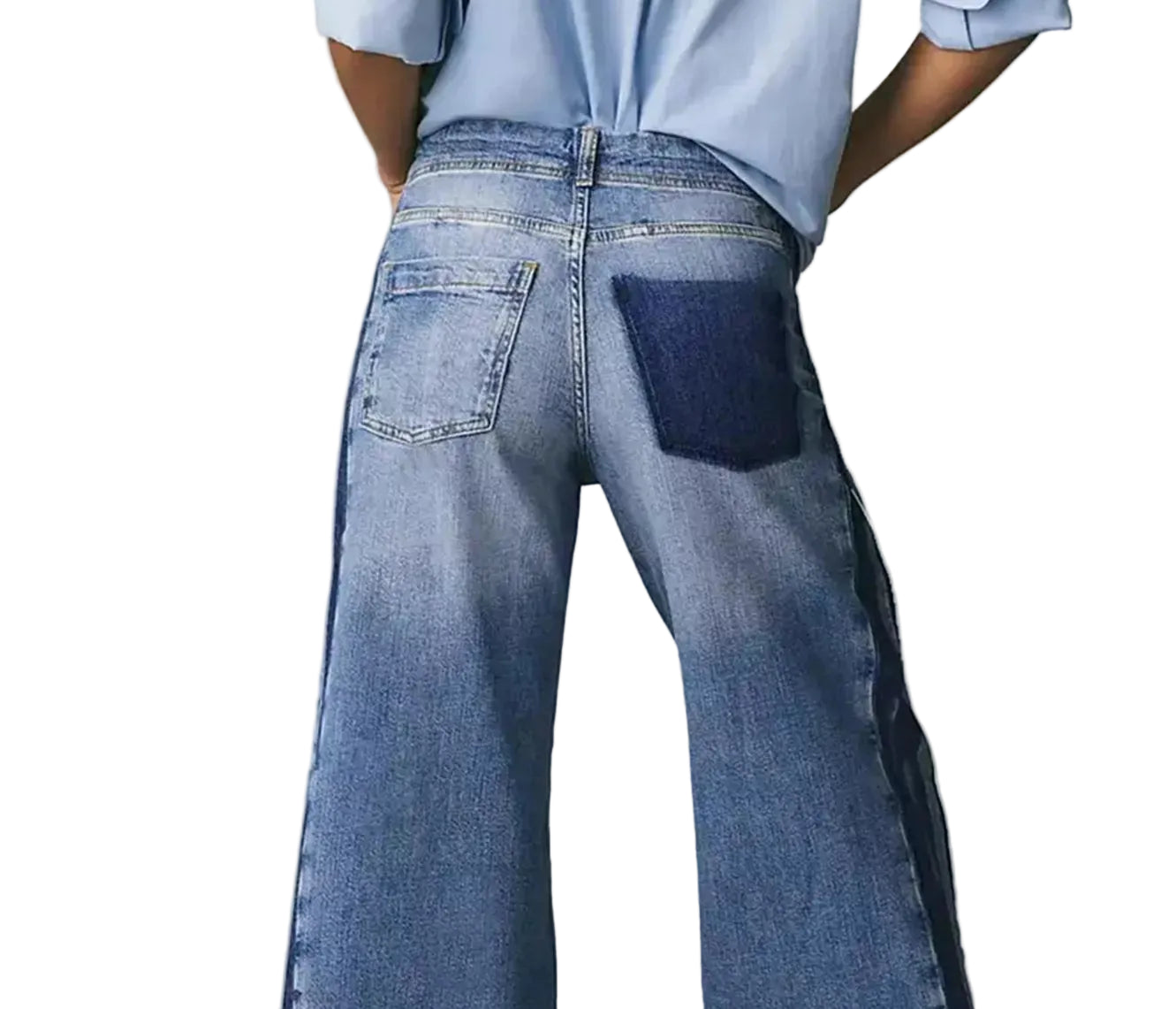 Person wearing blue wide-leg jeans on a plain background