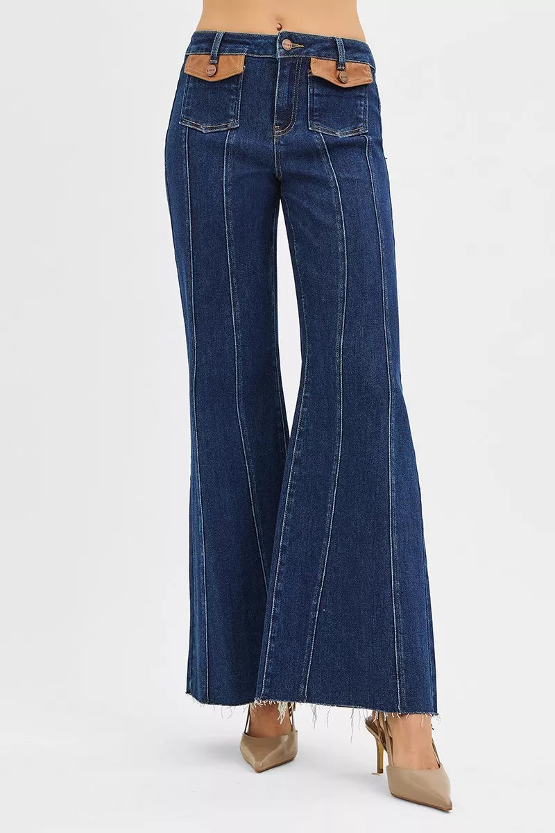 Back view of high-rise wide flare jeans in dark denim with two patch pockets