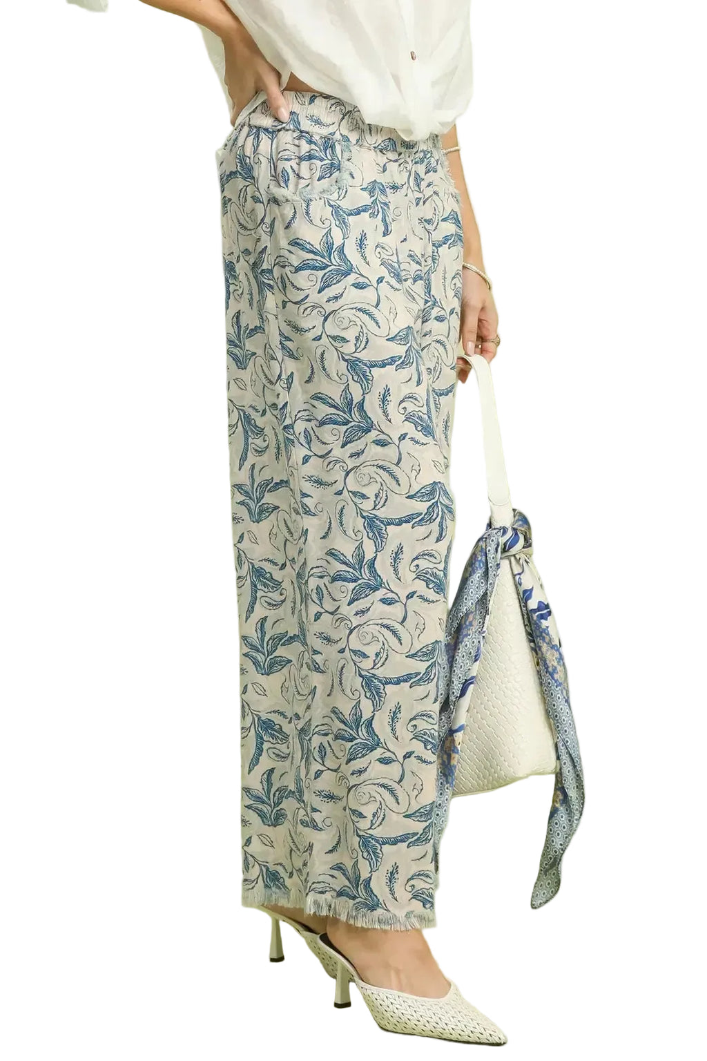 Side view linen wide-leg pants with ocean blue floral print and raw hem