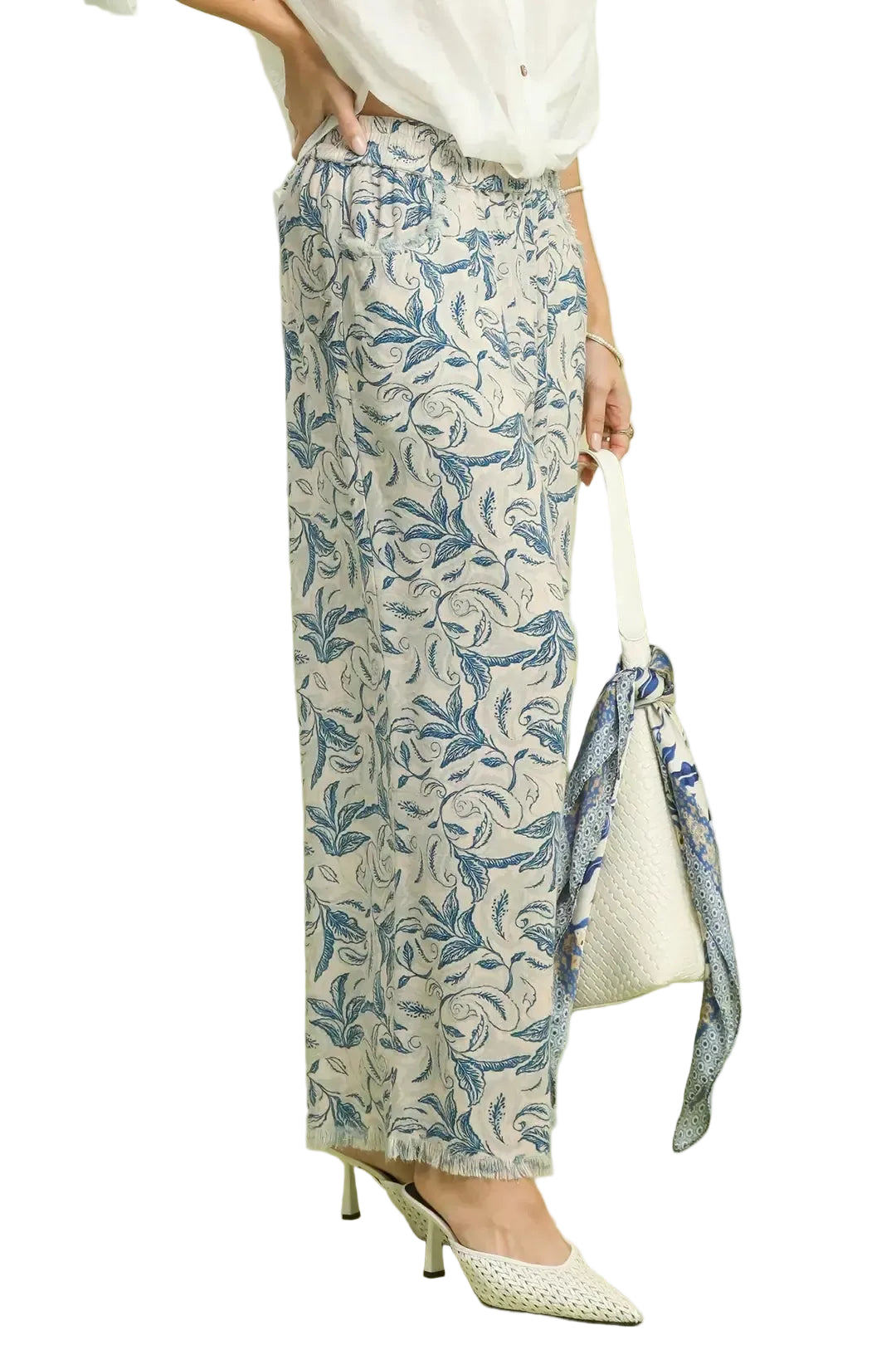 Side view linen wide-leg pants with ocean blue floral print and raw hem