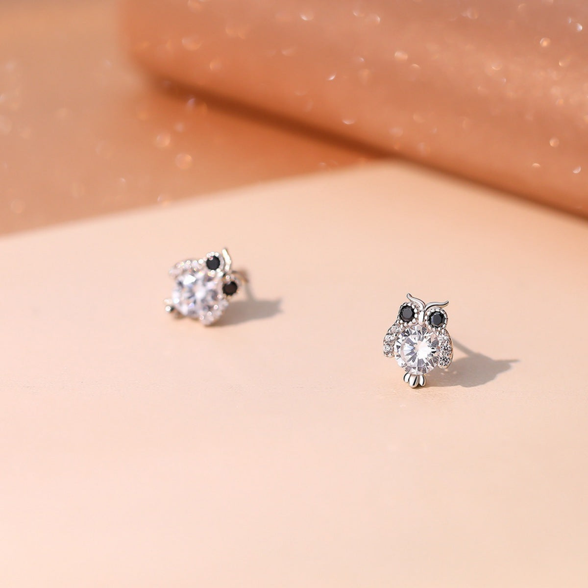 Owl stud earrings—silver owl with clear center crystal and small black top stones