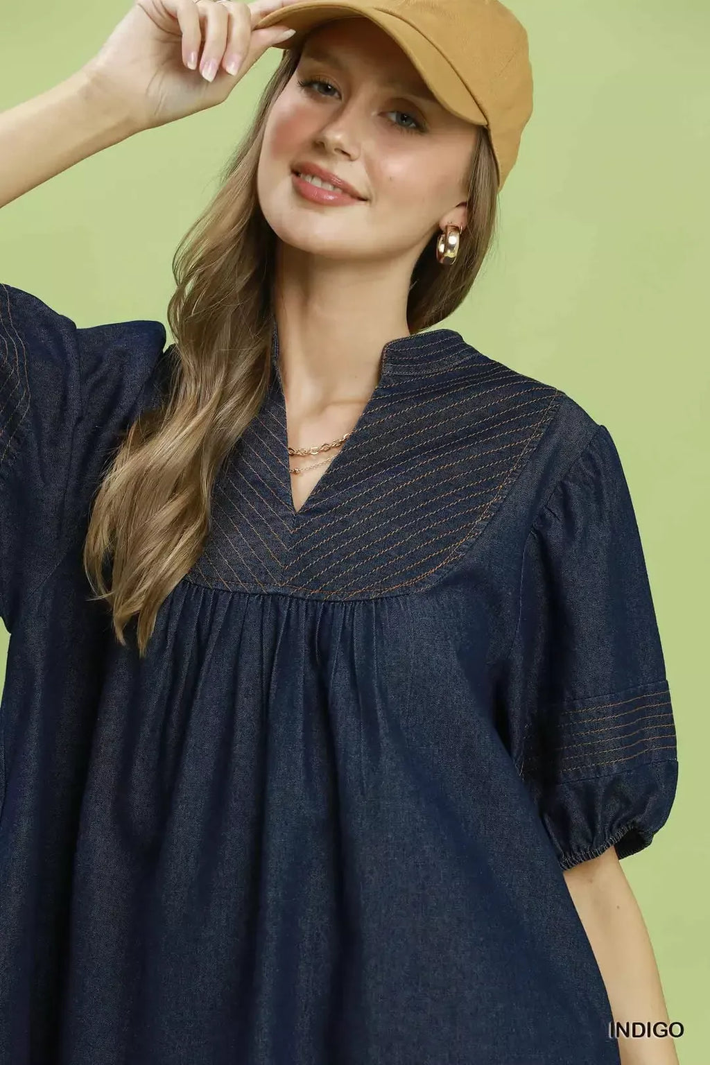 Indigo blue V-neck mini dress with gathered bodice and puff sleeves