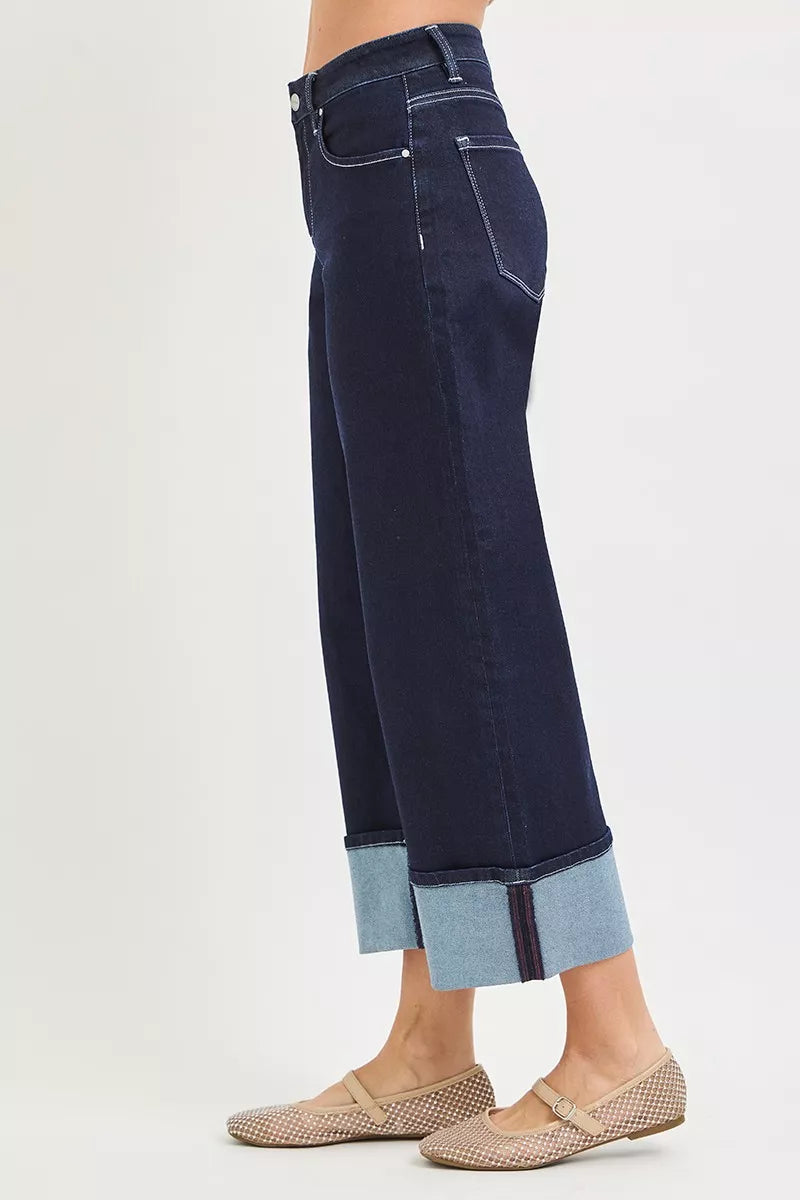 Dark wash slouchy crop jeans with cuffed hem detail and classic five-pocket styling