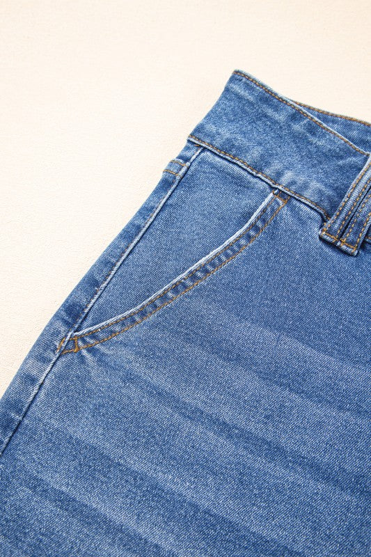 Straight-leg jeans side seam and belt loop close-up with contrast stitching