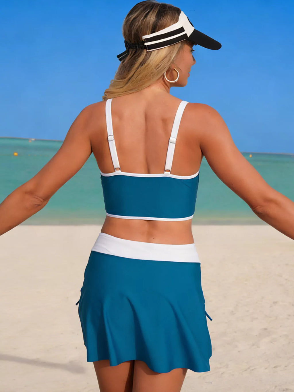 Peacock blue swim set with contrast trim: halter top and drawstring skirt