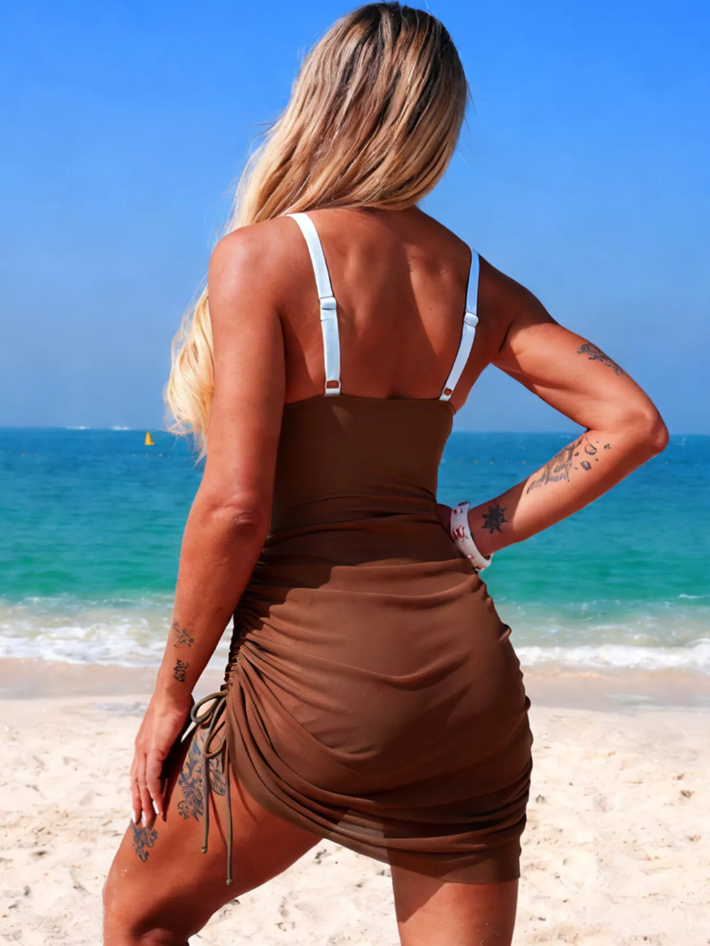 Brown cutout one-piece swimsuit back view with adjustable shoulder straps and side ties