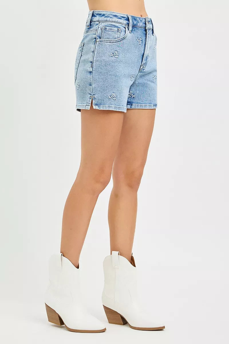 Light wash denim shorts with embroidered accents and side seam detailing