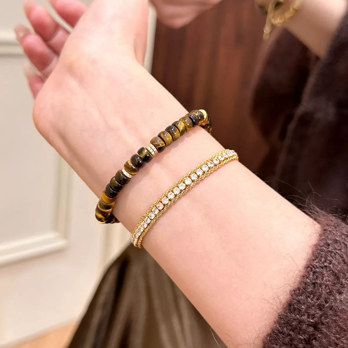 Tiger's Eye beaded bracelet on wrist, brown and black striped bead design