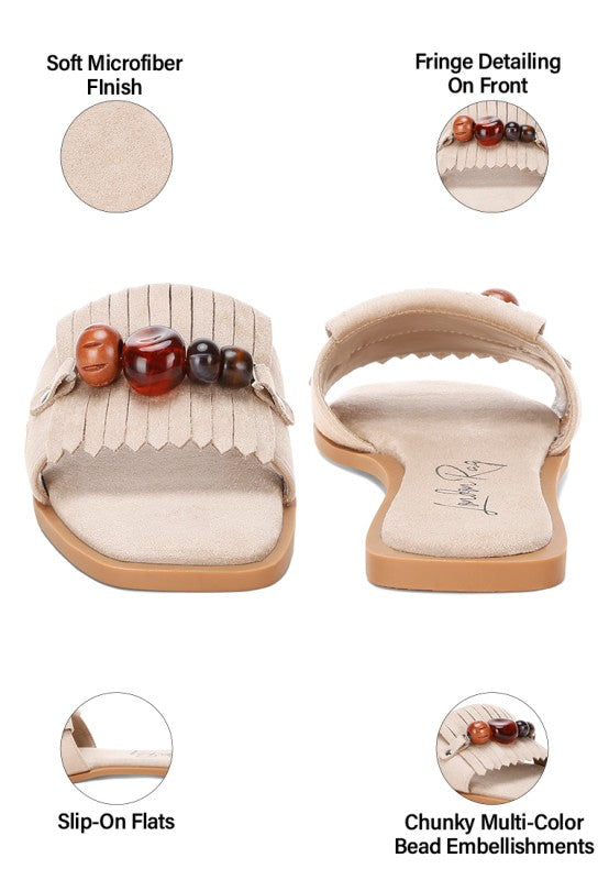Beige microfiber slide sandal, front and side views with bead cluster and fringe trim