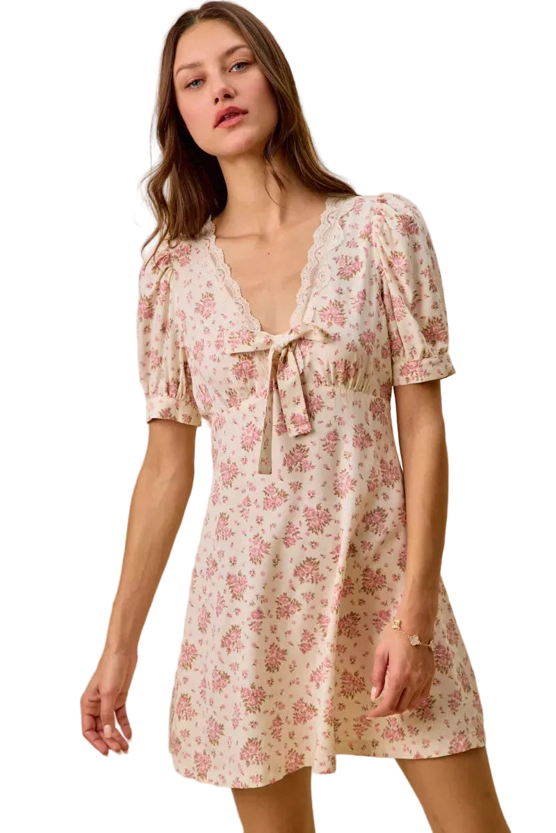 Cream floral mini dress, lace-edged V-neck and short puff sleeves with bow detail