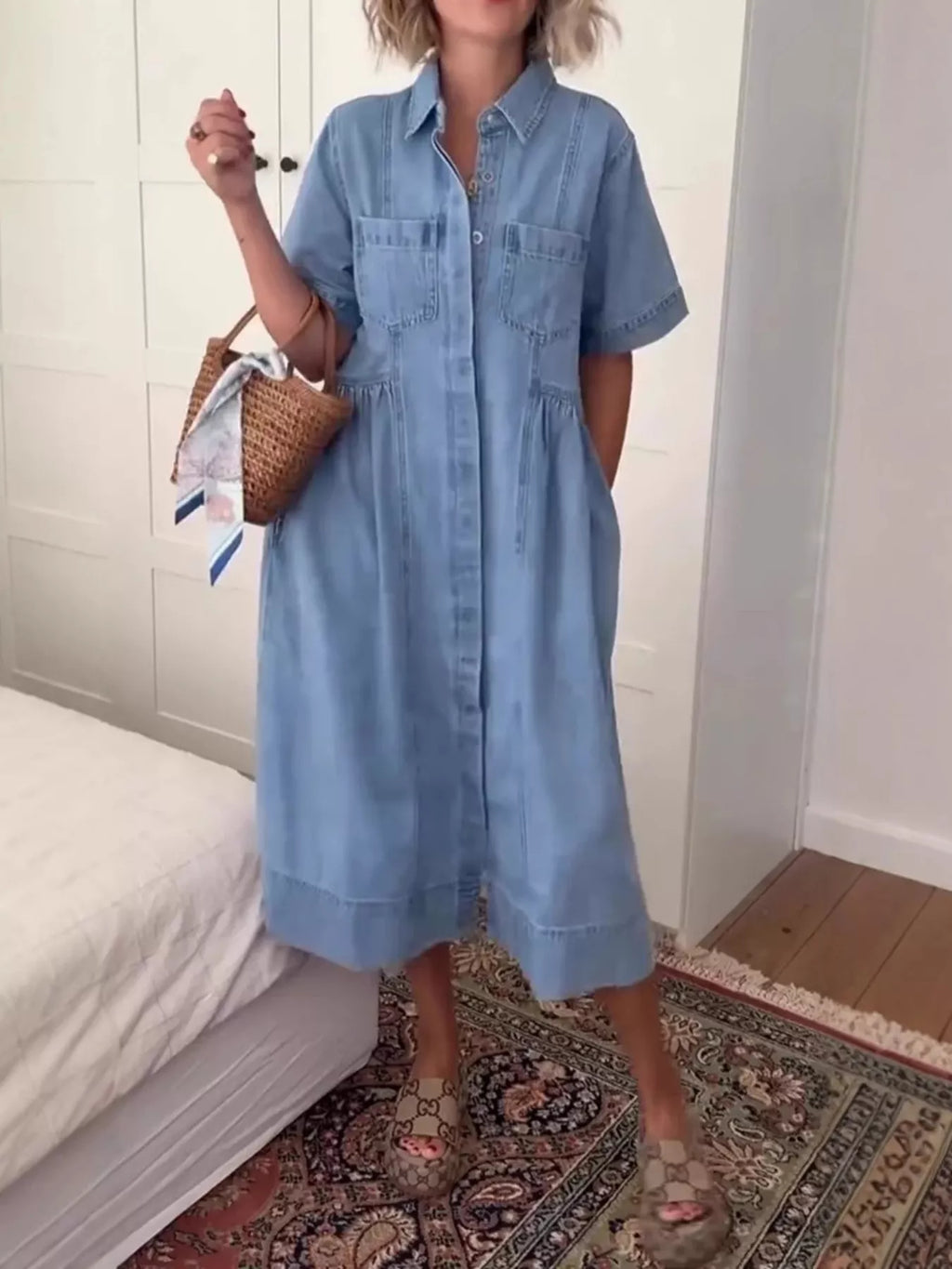 Blue button-front denim midi dress with short sleeves, collar, and pockets