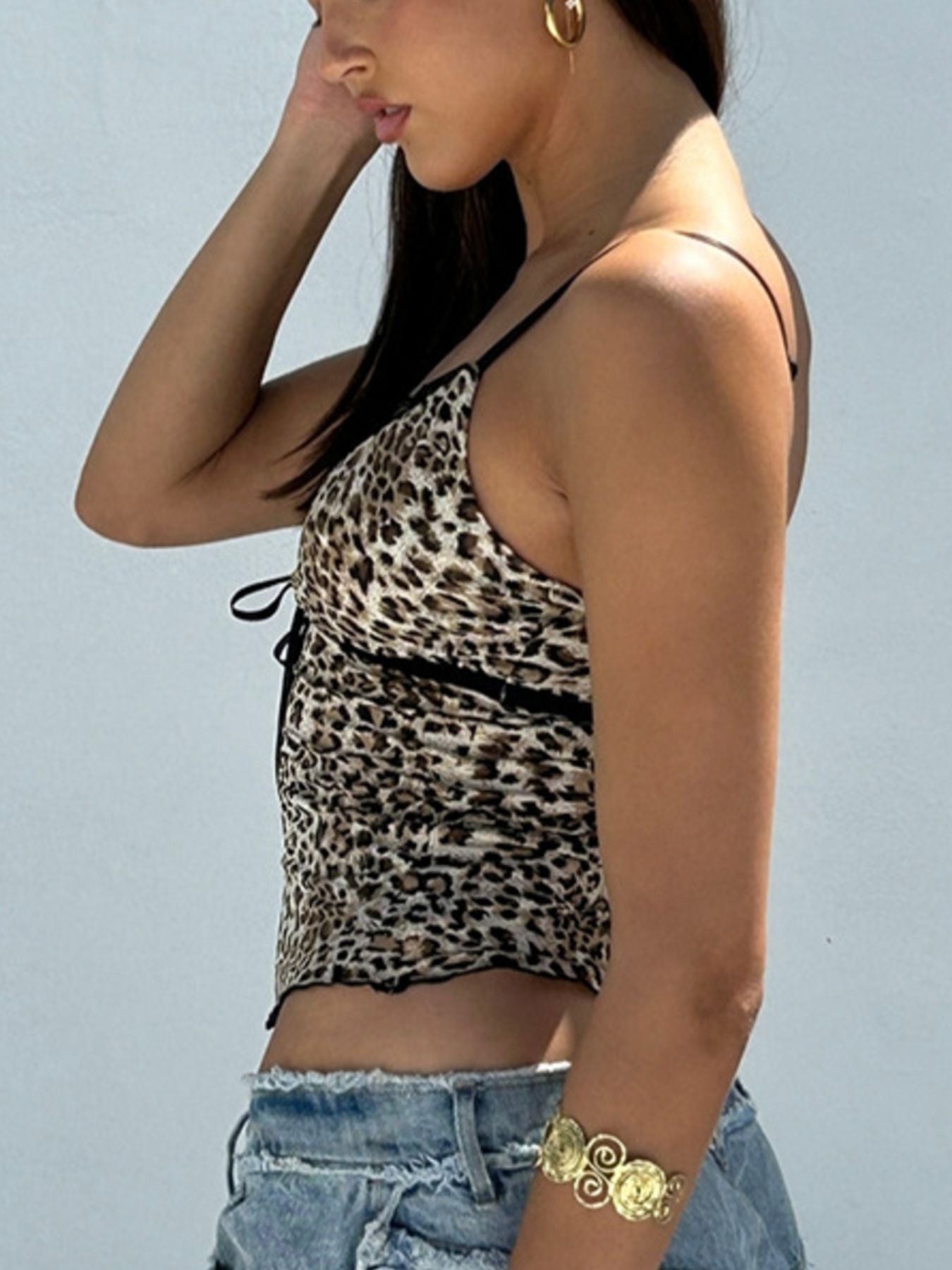 Leopard cami with scoop neckline, black lace trim, and thin adjustable straps