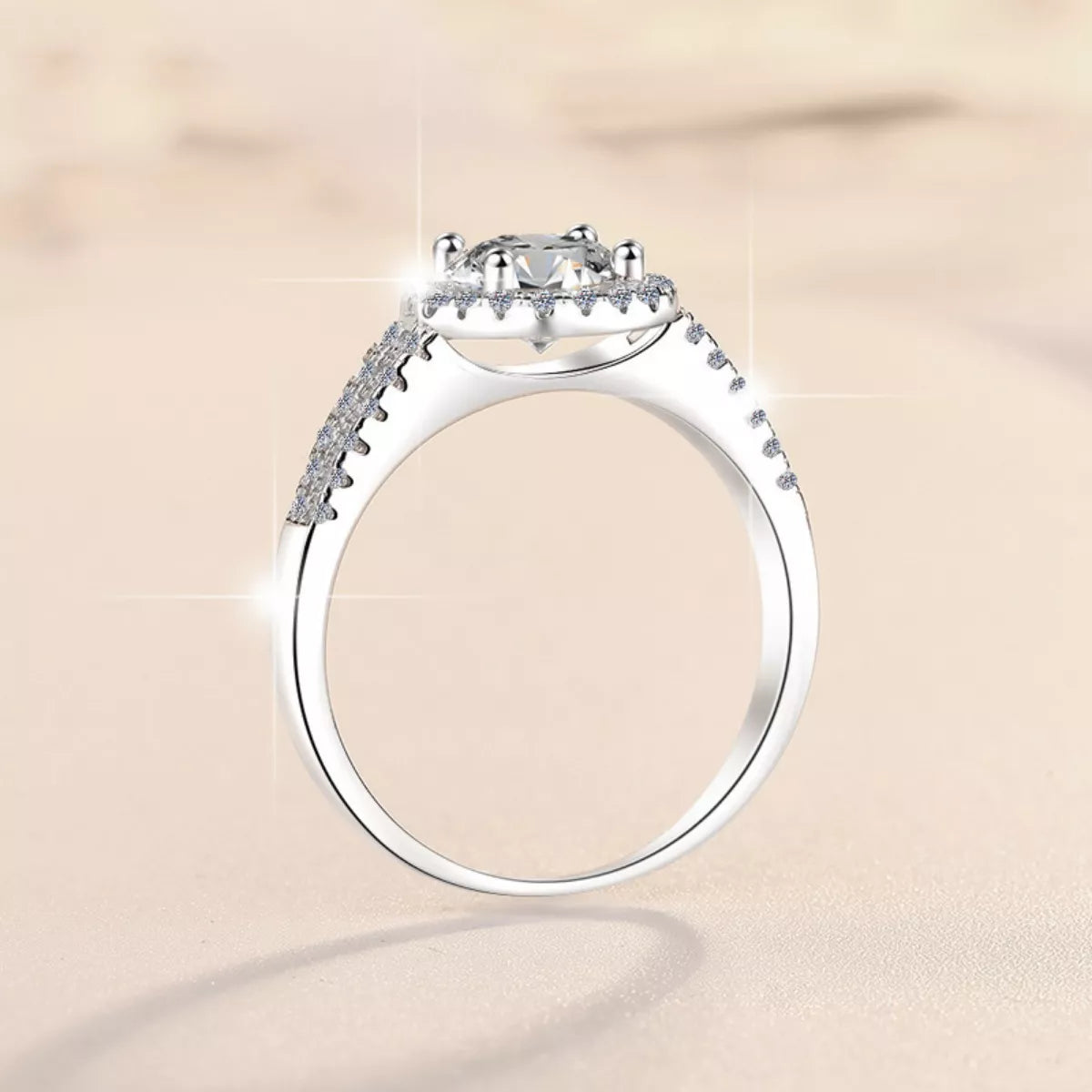925 sterling silver moissanite ring, top view with round halo and prong-set center