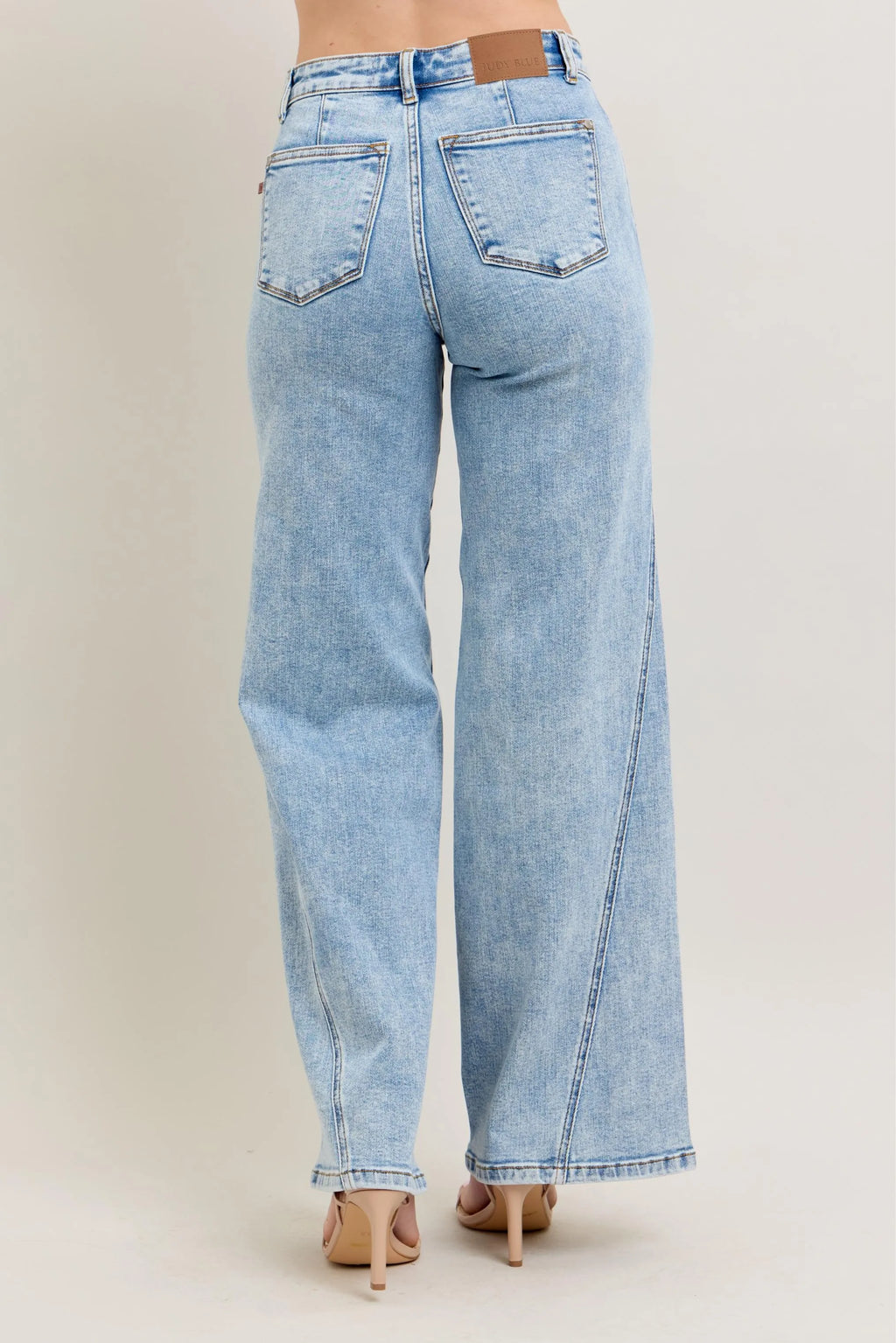 Light wash high-waist wide-leg jeans, back view with belt loops and center seam