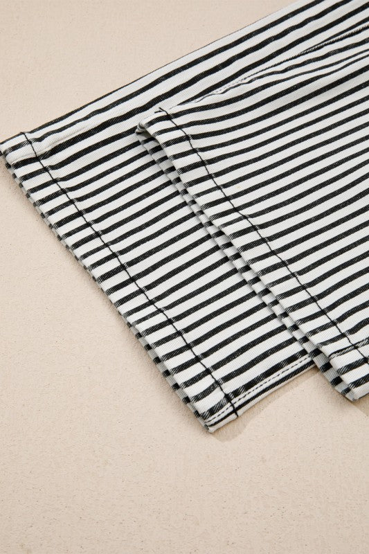 Striped denim jeans with visible hem stitching and waistband fabric detail
