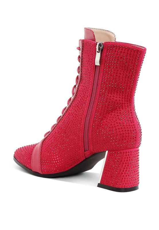 Fuchsia ankle boots with rhinestone texture, side zipper, and block heel