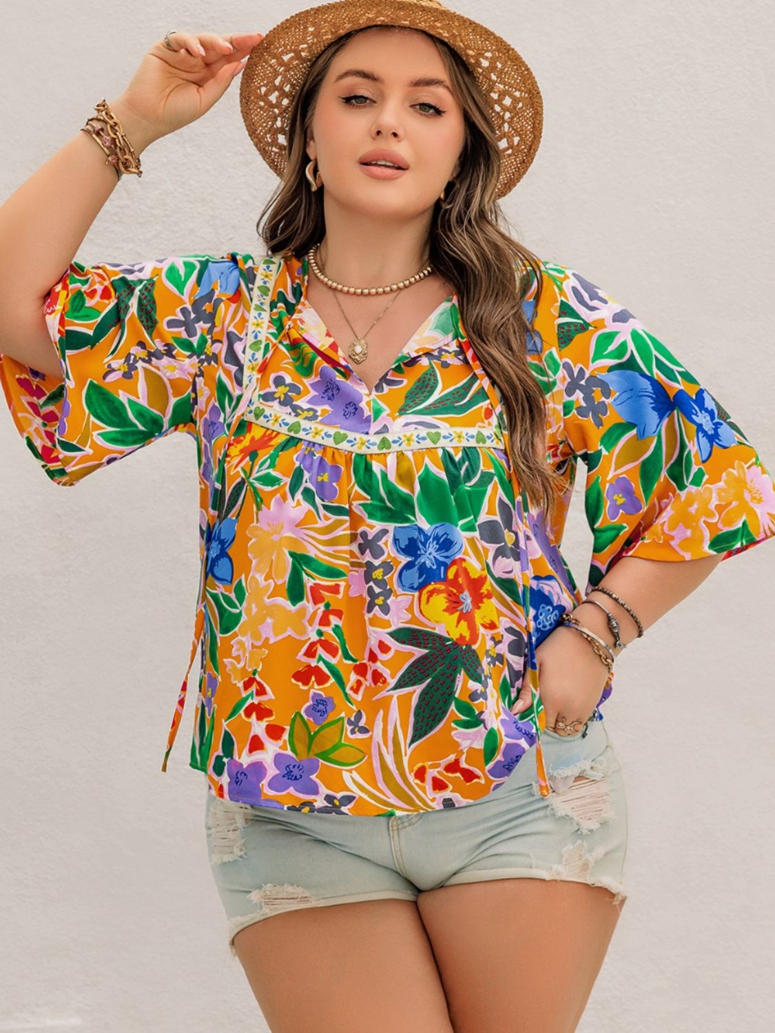 Plus Size Printed Tie Neck Half Sleeve Blouse - Tigbul's Variety Fashion Shop