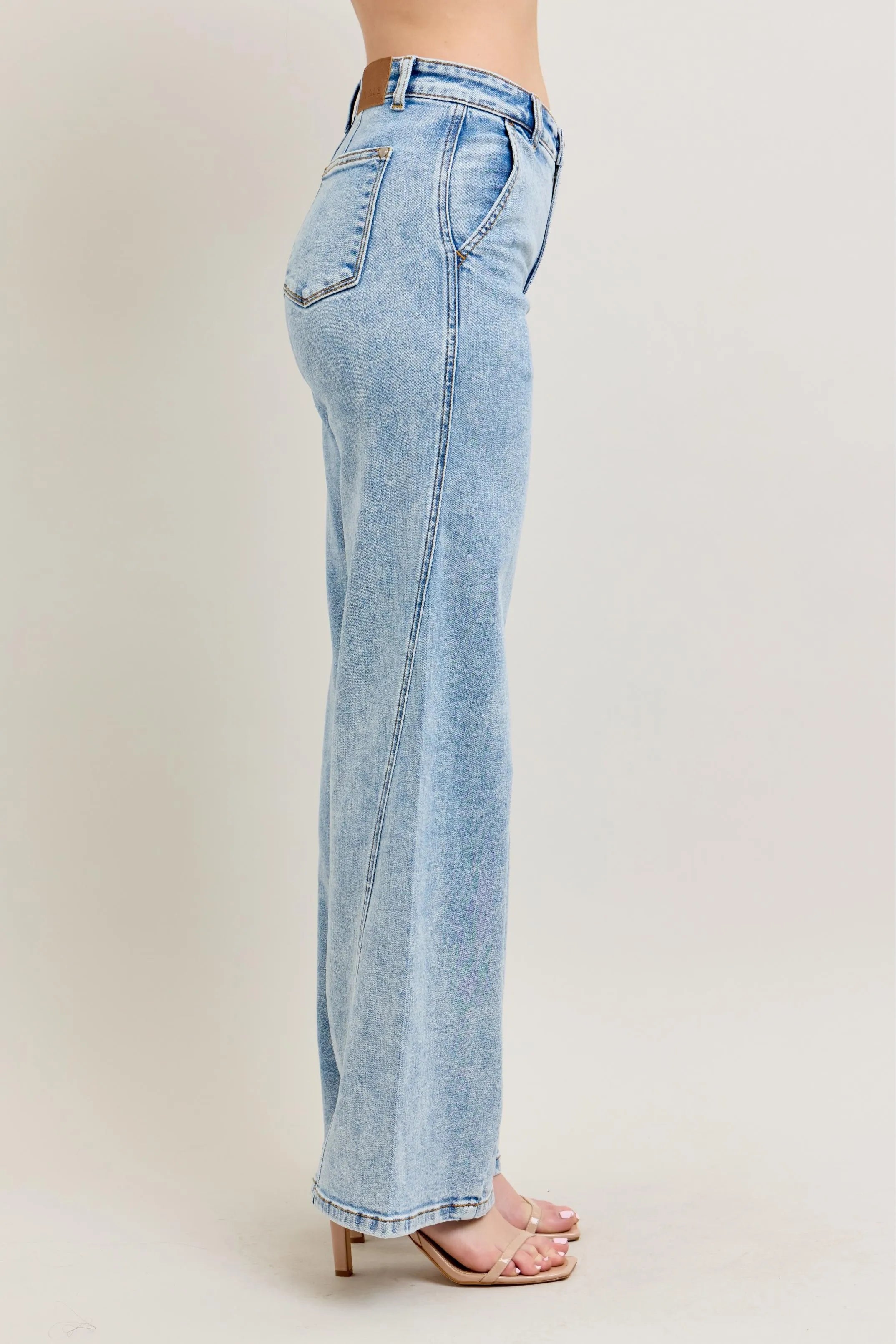 Light wash wide-leg jeans, back side view with belt loops and seam details