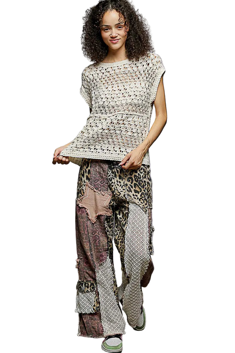 Sleeveless natural crochet top with openwork pattern and round neckline