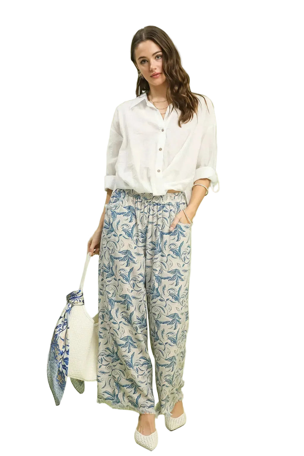 Printed linen wide-leg pants in ocean blue leaf pattern with raw frayed hems