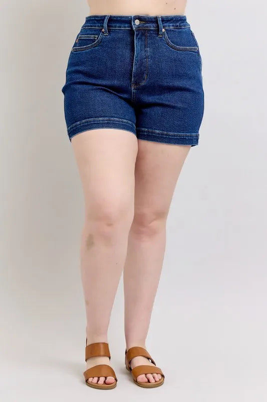 Dark blue denim shorts, back view with two patch pockets and high-rise waistband