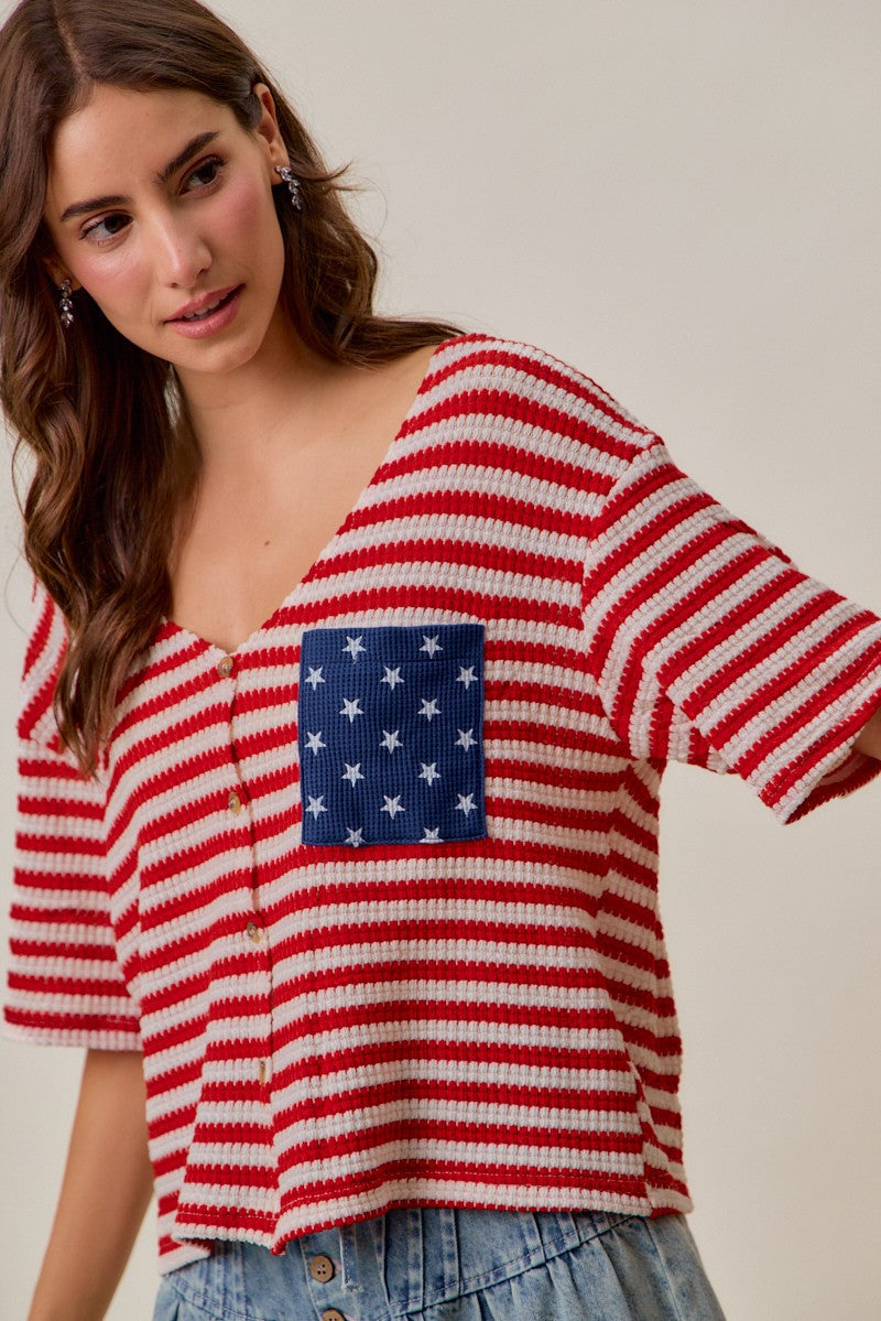 Red-and-ivory striped waffle-knit cardigan with blue star pocket panel and button closure