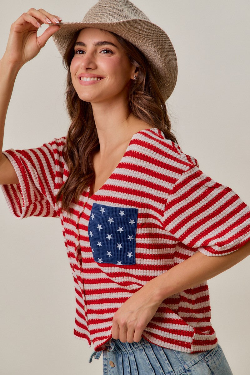 Red-and-ivory stripe cardigan with blue star patch pocket and short, cuffed sleeves