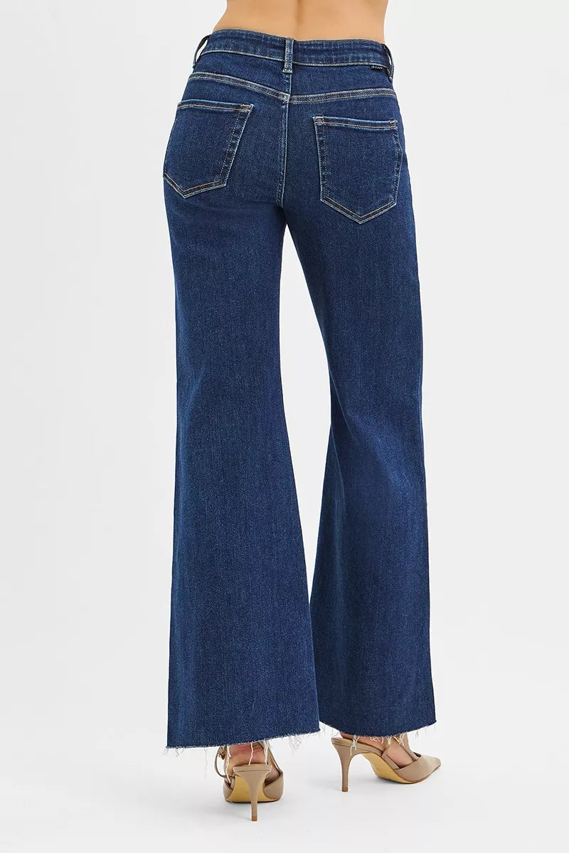 High-rise wide flare jeans in dark denim with back yoke and button closure