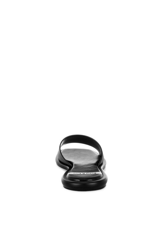 Black square-toe flat slide sandals, heel-toe sole profile view