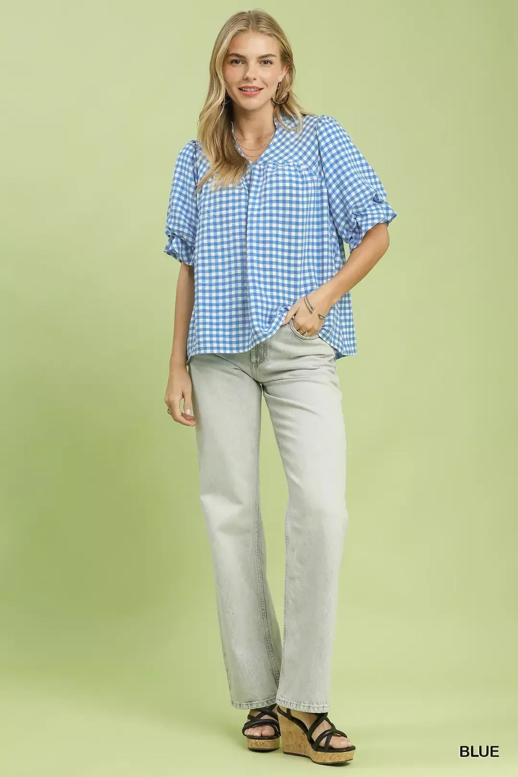 Blue gingham blouse with short puff sleeves and button front, relaxed fit