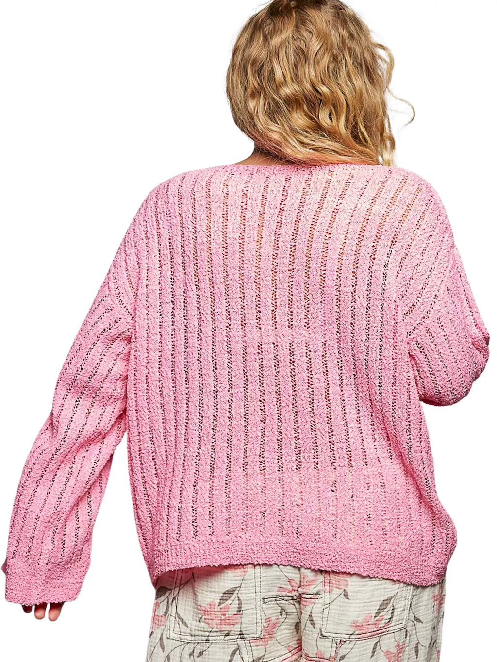 Pink open-knit coverup sweater with long sleeves, back view