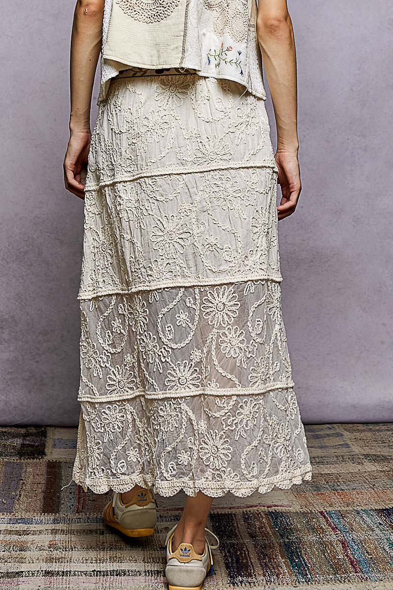 Natural embroidered tiered skirt with layered lace panels and scalloped hem