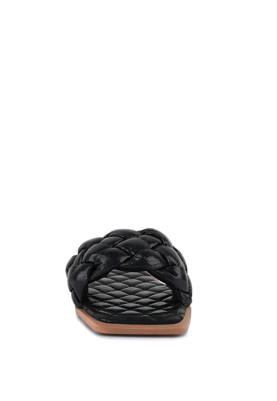 Front view of black patent PU quilted slides showing braided strap weave