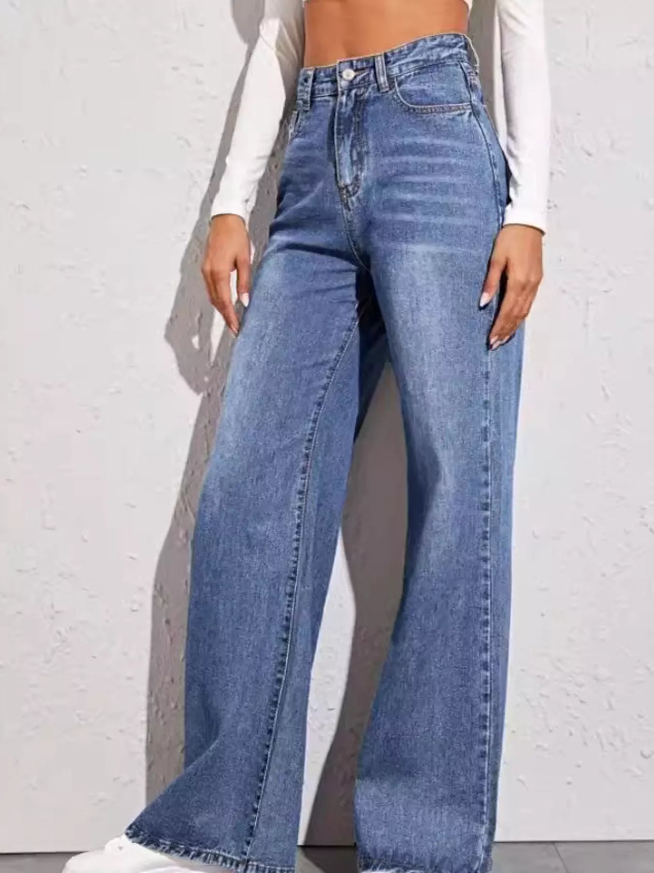 Light blue high-waisted wide-leg jeans with classic pockets and stitched front seams