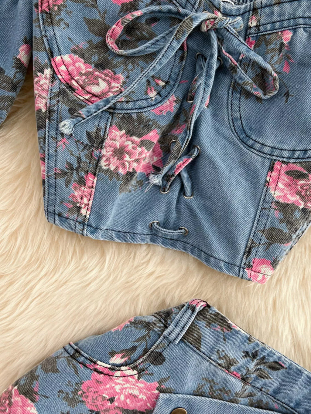 Blue denim skirt with pink floral print, lace-up drawstring and pockets