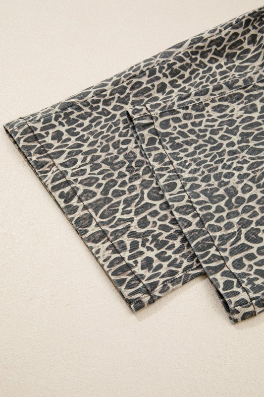 Leopard-print denim pant leg with contrast stitching and folded cuff