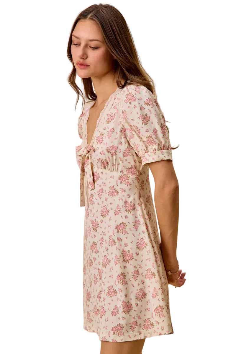 Cream floral short-sleeve mini dress with lace-trimmed neckline and ruched bust