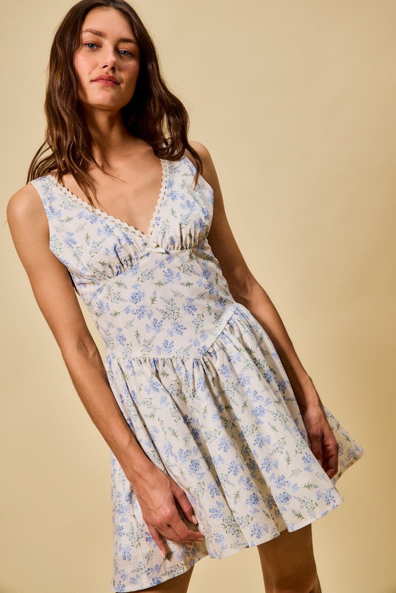 Blue floral mini dress with sleeveless V-neck and gathered fit-and-flare skirt