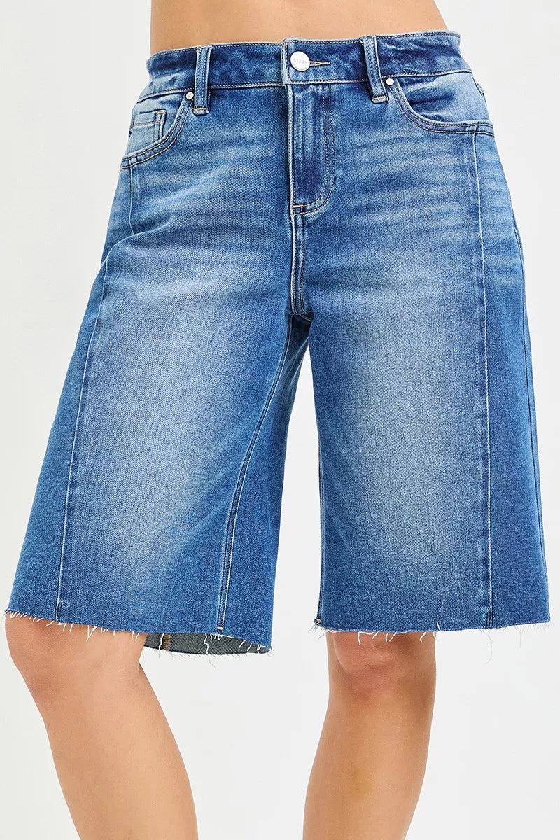Slouchy seamed jorts in medium wash denim, raw hem, button front, belt loops