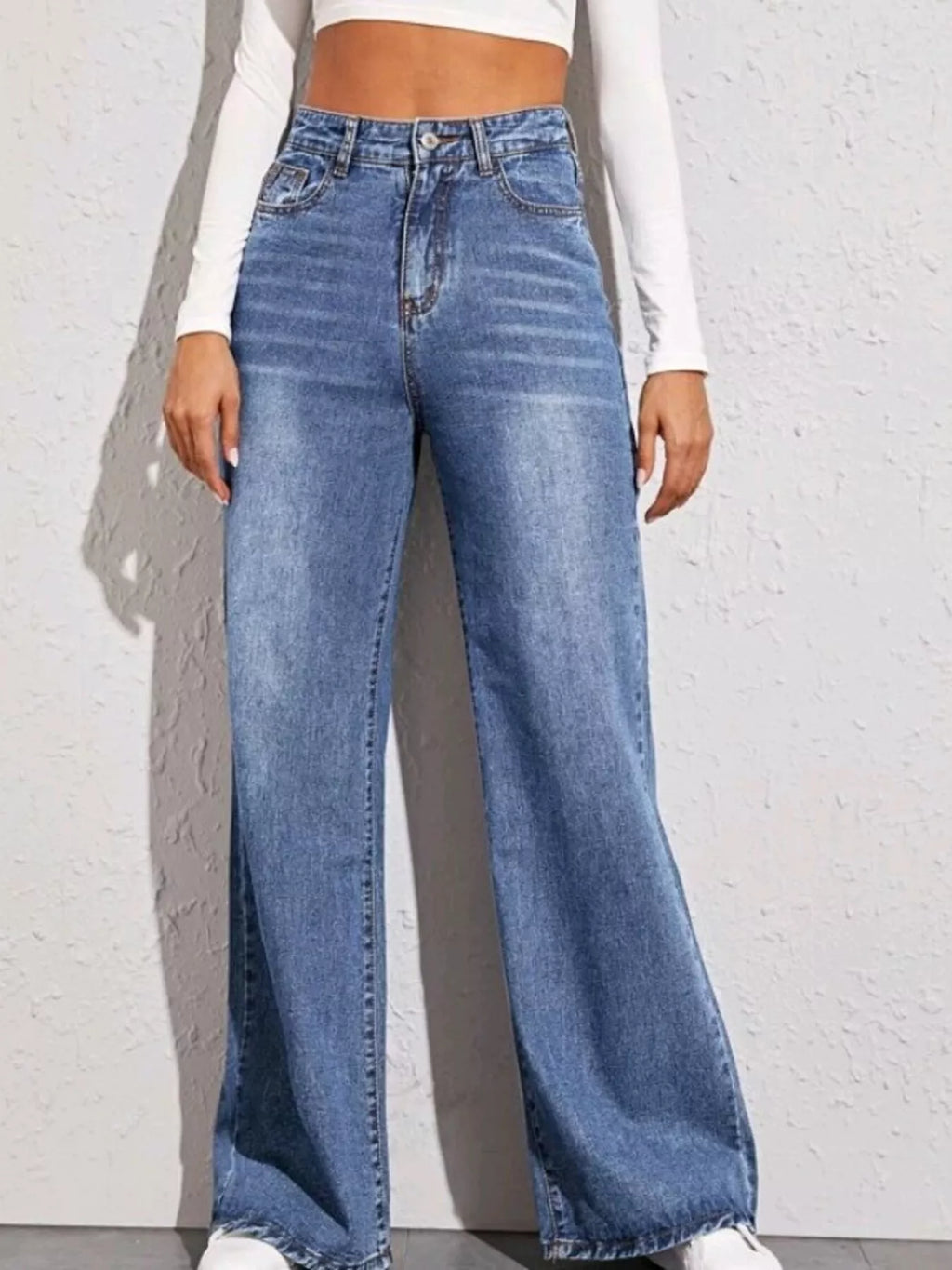 Light blue high-waisted wide-leg jeans with button-zip fly and front pockets