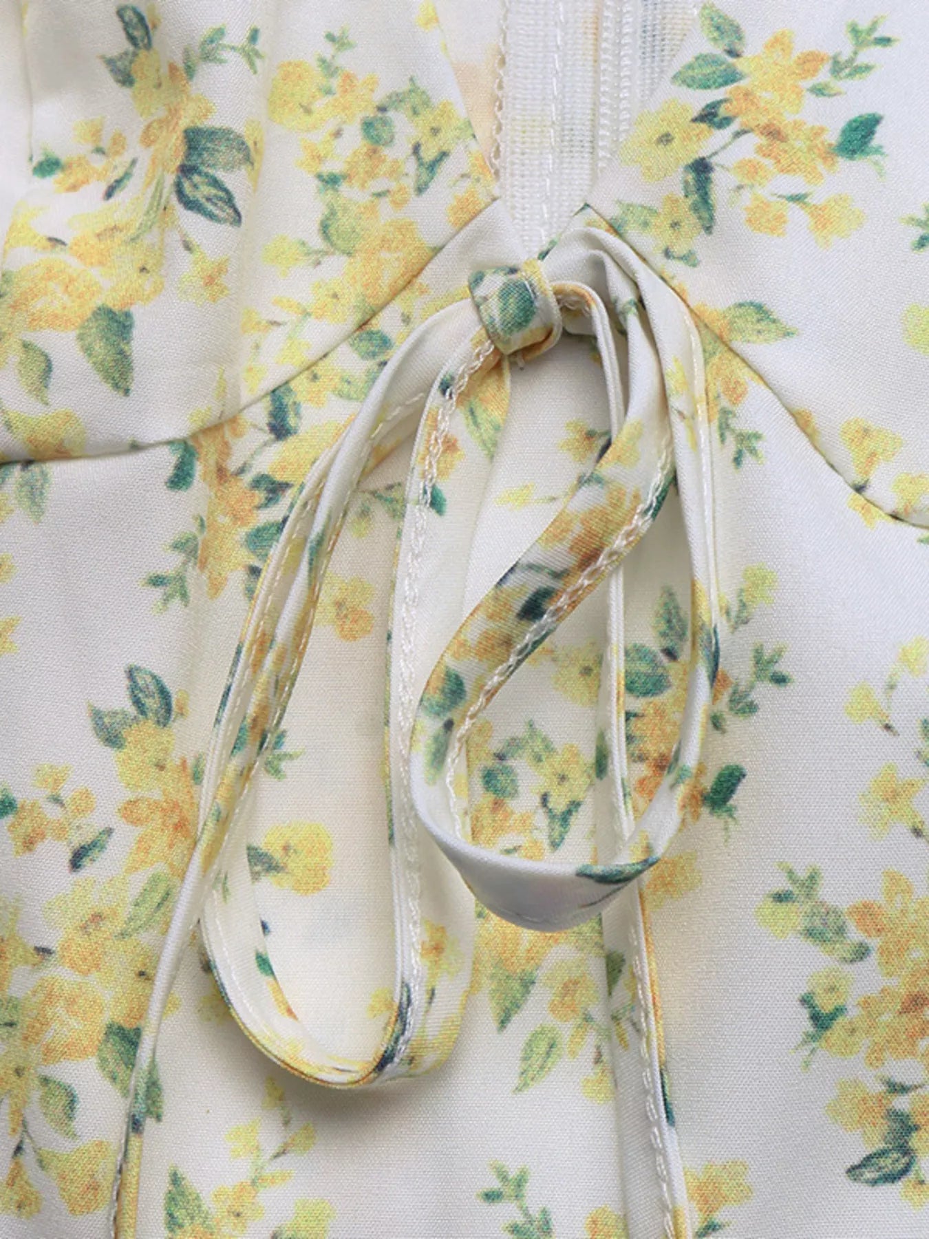 Neckline tie detail on yellow floral puff-sleeve mini dress