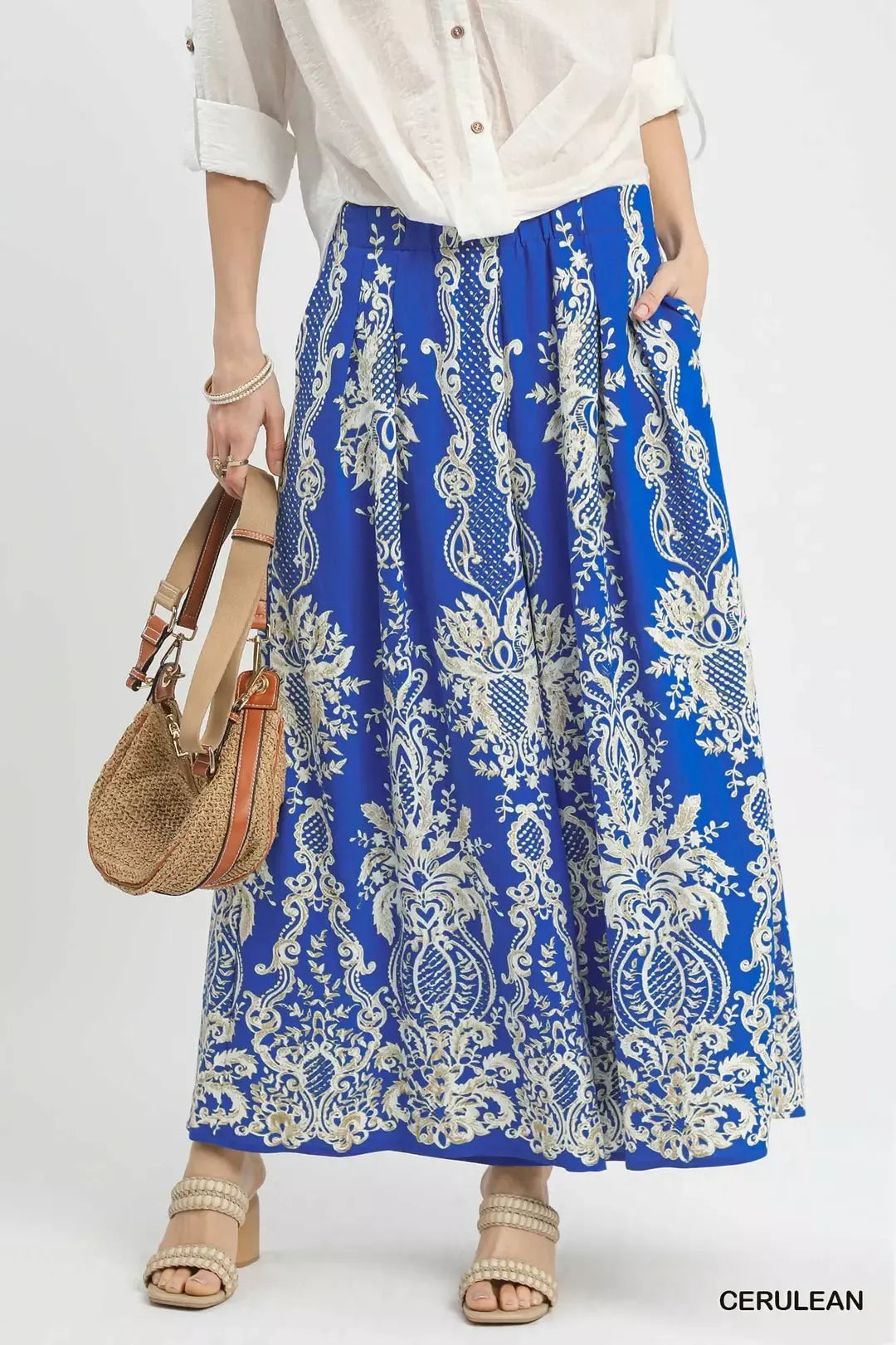 Blue border print wide-leg pants with elastic waist and billowy, full length fit